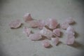 bunch of rosequartz stones on the floor