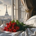 Bunch of roses on a bad in the room of a luxury hotel with the view on Eifel tower