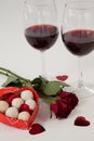 Bunch of roses, wine glasses and assorted chocolate box Royalty Free Stock Photo