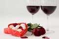 Bunch of roses, wine glasses and assorted chocolate box Royalty Free Stock Photo