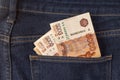 Bunch of 5000 rouble banknotes in the back pocket of a blue jeans. Royalty Free Stock Photo