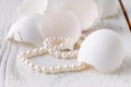 Bunch round white shiny pearls with white background