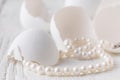 Bunch round white shiny pearls with white background