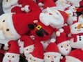 A bunch of Santa Claus Father Christmas plush soft toys on display Royalty Free Stock Photo