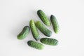 A bunch of several pickle cucumbers lie on a white background. Royalty Free Stock Photo