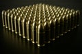 Bunch of shiny 9 mm brass ammo on dark wooden desk
