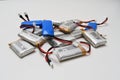 Bunch of small blue and grey drone li-po batteries