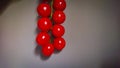 A Bunch Of Small Cherry Tomatoes Against A Gray Wall Background. Stylized Photo Under The Oil Painting In Selective Focus Royalty Free Stock Photo