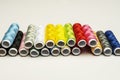 A bunch of spools of different colored sewing thread Royalty Free Stock Photo