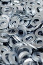 Bunch of stainless steel galvanized flat washers for fastener screws, nuts or bolts Royalty Free Stock Photo