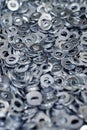 Bunch of stainless steel galvanized flat washers for fastener screws, nuts or bolts Royalty Free Stock Photo