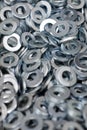 Bunch of stainless steel galvanized flat washers for fastener screws, nuts or bolts Royalty Free Stock Photo