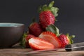 Cutting strawberries on a kitchen board Royalty Free Stock Photo