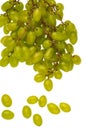 A bunch of table grapes on a white background and a bunch of white grapes scattered on a white background Royalty Free Stock Photo