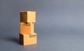A bunch of three cardboard boxes. The concept of products and goods, commerce and retail. E-commerce, sales and sale of goods