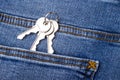 A bunch of three new keys in the back pocket of jeans Royalty Free Stock Photo