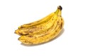 A bunch of three overripe bananas close-up isolated on a white background.