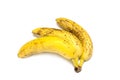 A bunch of three overripe bananas close-up isolated on a white background. Royalty Free Stock Photo