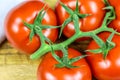 Bunch tomatoes on a cutting board Royalty Free Stock Photo
