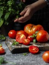 Bunch of tomatoes on a cutting board Royalty Free Stock Photo