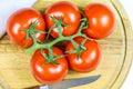 Bunch tomatoes on a cutting board Royalty Free Stock Photo