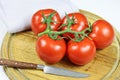 Bunch tomatoes on a cutting board