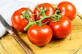 Bunch tomatoes on a cutting board Royalty Free Stock Photo