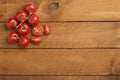 Bunch tomatoes on wood Royalty Free Stock Photo