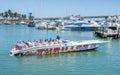 Miami, Florida - April 17, 2018: Tourists getting a thrill on a speed boat at Bayside