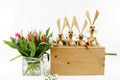 A bunch of tulips and easter rabbits in a wooden box Royalty Free Stock Photo