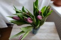 bunch of tulips laying on a wooden board
