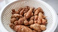 Turmeric in a white plastic basket