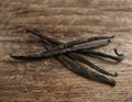 Bunch of vanilla sticks on wooden background Royalty Free Stock Photo