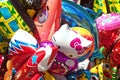 Bunch of various cartoon characters balloons at fair