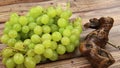 Bunch of white grapes and corkscrews in close-up