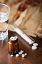 Bunch of white pills with glass ampoules, water Royalty Free Stock Photo