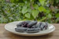 bunch of witch finger grapes on white plate Royalty Free Stock Photo