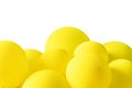 A bunch of yellow balloons floating on a white isolated background. The balloons are of similar size