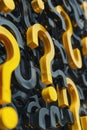 A bunch of yellow and black question marks painted on a wall. Suitable for various concept and mystery-themed designs Royalty Free Stock Photo