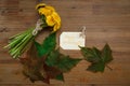 Bunch of Yellow Dandelions,Birthday Wish Card,Green Leaves.Autumn Garden's Background.Wooden Table Royalty Free Stock Photo