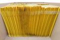 Bunch of yellow padded envelopes in a shipping box Royalty Free Stock Photo