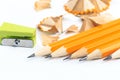 Bunch of yellow pencils with shawings and pencil sharpeners isolated on white - Image