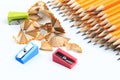 Bunch of yellow pencils with shawings and pencil sharpeners isolated on white- Image Royalty Free Stock Photo