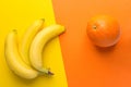 Bunch of yellow ripe bananas orange on duotone background. Creative trendy flat lay. Healthy food clean eating Royalty Free Stock Photo