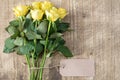 Bunch of yellow roses with blank tag Royalty Free Stock Photo