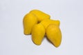 Bunch of yellow sweet mangoes on white background