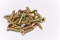Bunch of yellow zinc coated philips flat head cross screws - fasteners Royalty Free Stock Photo