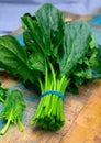 Bunch of young fresh leaves of green organic spinach ready to cook Royalty Free Stock Photo