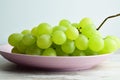 Bunch of yummy green grapes on the pla