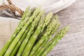 Bunches of asparagus tied on a burlap background Royalty Free Stock Photo